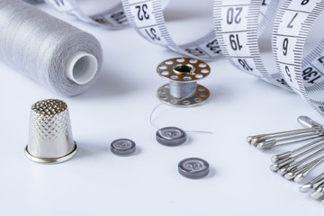 Sewing accessories and accessories for needlework in gray-blue shades.