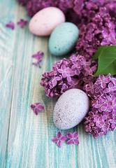 Spring lilac flowers and easter eggs