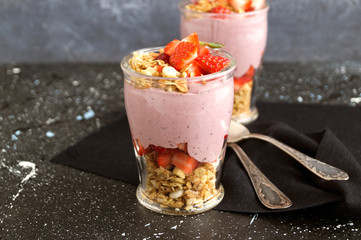 Homemade natural yogurt with strawberries and muesli.