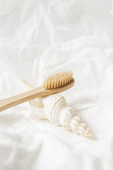 Fototapeta na wymiar Close up of bamboo toothbrush, zero waste concept