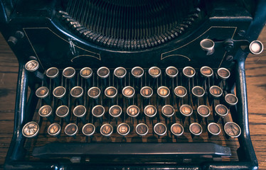 Vintage typewriter machine. Color graded image of rustic typing kayboard.