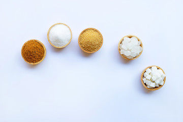 Various types of sugar on white.