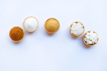 Various types of sugar on white.