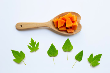 Papaya fruit with leaves on a white