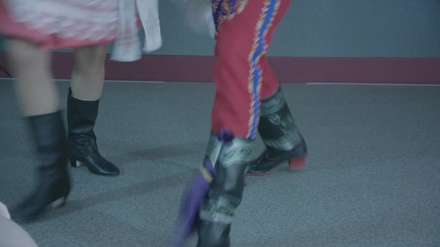 dancing legs of men and women in Czech costumes