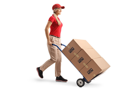 Female worker pushing boxes on a hand truck - Powered by Adobe