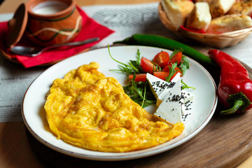 Classic egg omelette served with cherry tomat