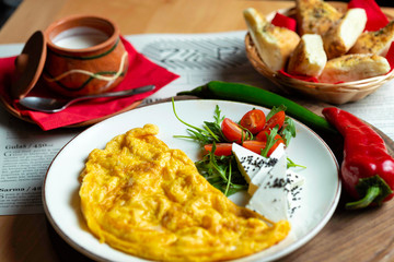 Classic egg omelette served with cherry tomat