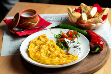 Classic egg omelette served with cherry tomat