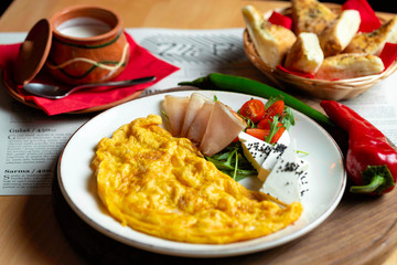 Classic egg omelette served with cherry tomat