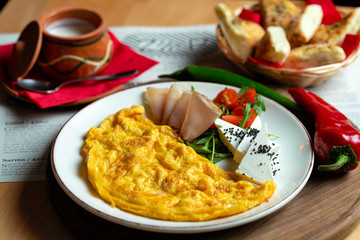 Classic egg omelette served with cherry tomat