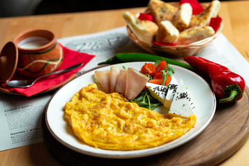 Classic egg omelette served with cherry tomat