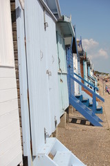 Fototapeta na wymiar Beach huts at Walton on the Naze, Beach Huts, Essex, England, beach huts are traditional seaside feature for people to change or base themselves. Walton-on-naze, Essex, UK