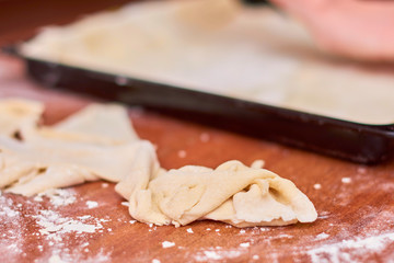 Dough for pizza on the wooden table, close-up. Dough for pizza.