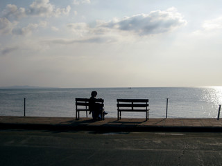 Fototapeta na wymiar bench on beach at sunset