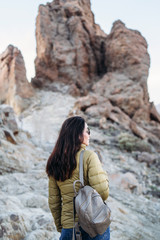 Fototapeta premium Pretty tourist brunette girl walking near mountains.