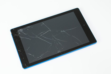 tablet with broken screen on white background