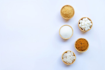 Various types of sugar on white.