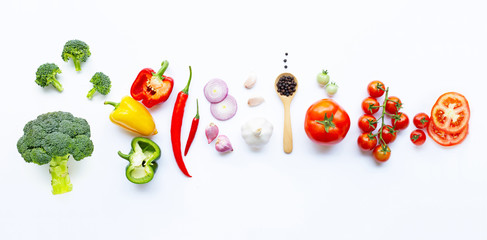 Various fresh vegetables and herbs on white. Healthy eating concept