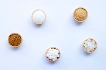Various types of sugar on white.