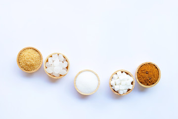 Various types of sugar on white.