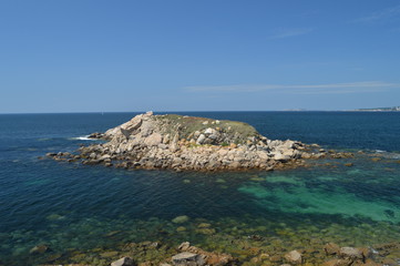 Islet Of The Illariña Turquoise Waters Surrounding Seen From The Fort Of The Hermitage In La Lanzada In Noalla. Nature, Architecture, History, Travel. August 19, 2014. Noalla, Pontevedra, Spain.
