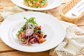 vegetarian salad with beetroot, honey agaric and red onion