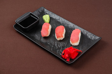 sushi on a black plate