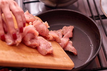 Raw chicken in the pan