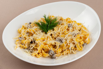 pasta with cheese in a white plate