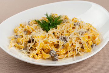 pasta with cheese in a white plate