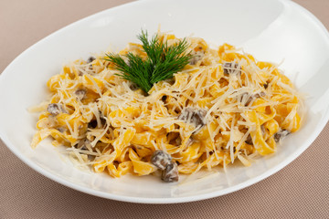 pasta with cheese in a white plate