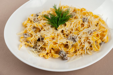 pasta with cheese in a white plate
