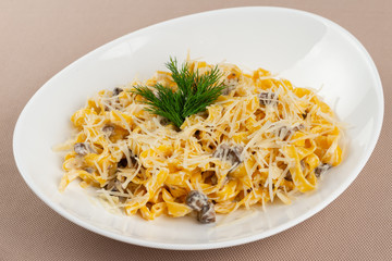 pasta with cheese in a white plate