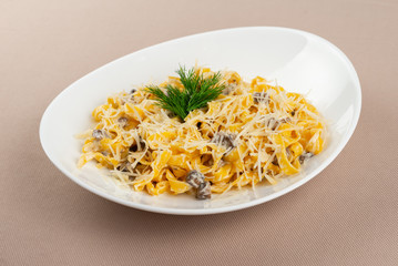 pasta with cheese in a white plate