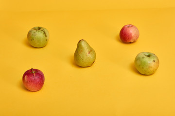 Fresh ripe pears and apples with leaves