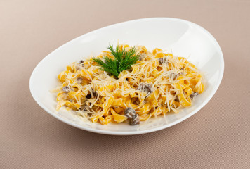 pasta with cheese in a white plate