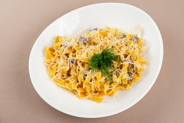 pasta with cheese in a white plate