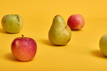 Fresh ripe pears and apples with leaves