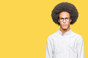 Fototapeta na wymiar Young african american man with afro hair wearing glasses skeptic and nervous, frowning upset because of problem. Negative person.