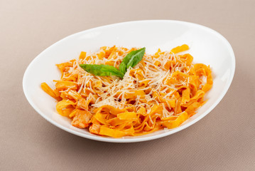 pasta with cheese in a white plate