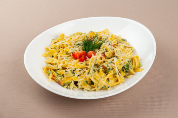 pasta with cheese in a white plate