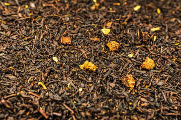 Dry black tea leaves with dried fruits
