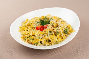 pasta with cheese in a white plate