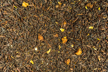 Dry black tea leaves with dried fruits