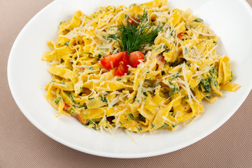 pasta with cheese in a white plate