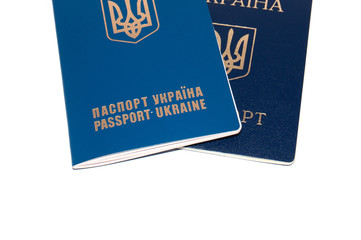 Two passports, foreign and Ukrainian on a white background, copy space for text