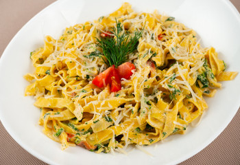 pasta with cheese in a white plate