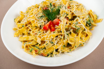 pasta with cheese in a white plate