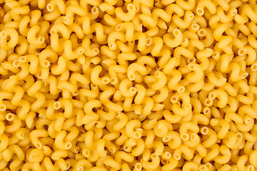 texture of raw Cavatappi Cellentani noodles pasta italian food macro background